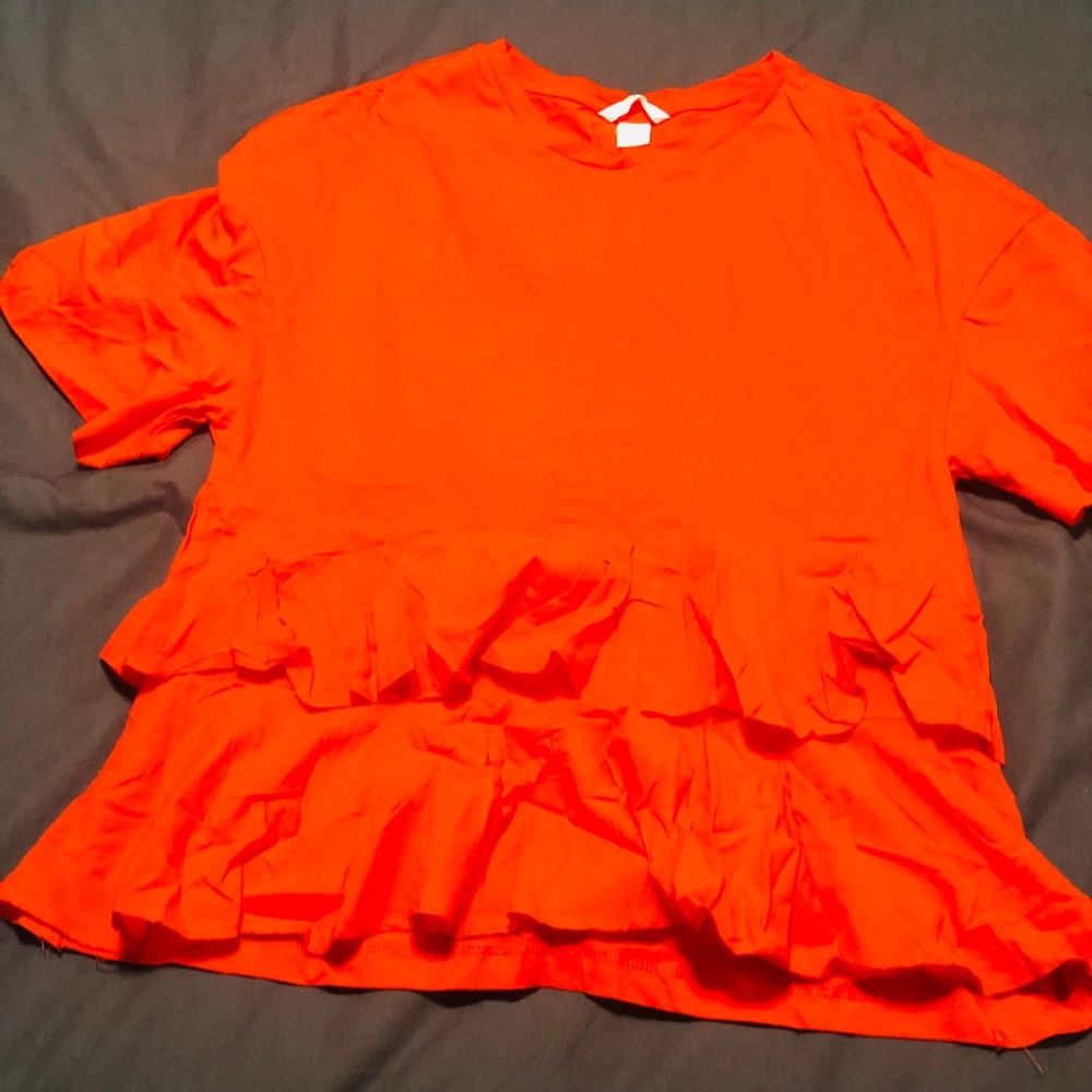 Orange ruffled short sleeve shirt